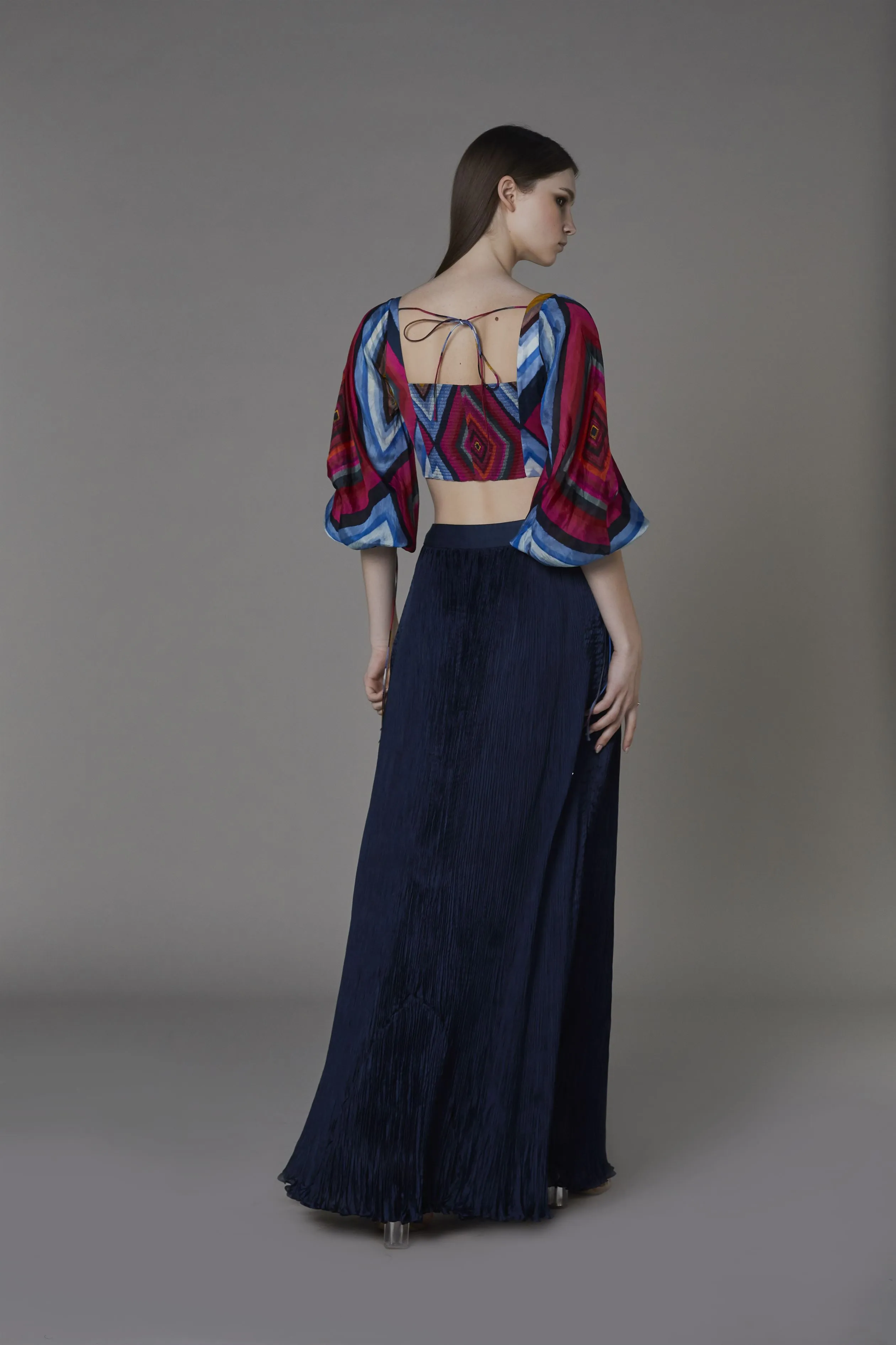 Saaksha & KinniÂ    I   Pink blue big diamond bustier with attached balloon sleeves

Navy blue non print pleated skirt Blouse - Satin

Skirt - Chiffon Blouse - Pink / blue

Skirt - Navy Blue   SS22102

  SS22103